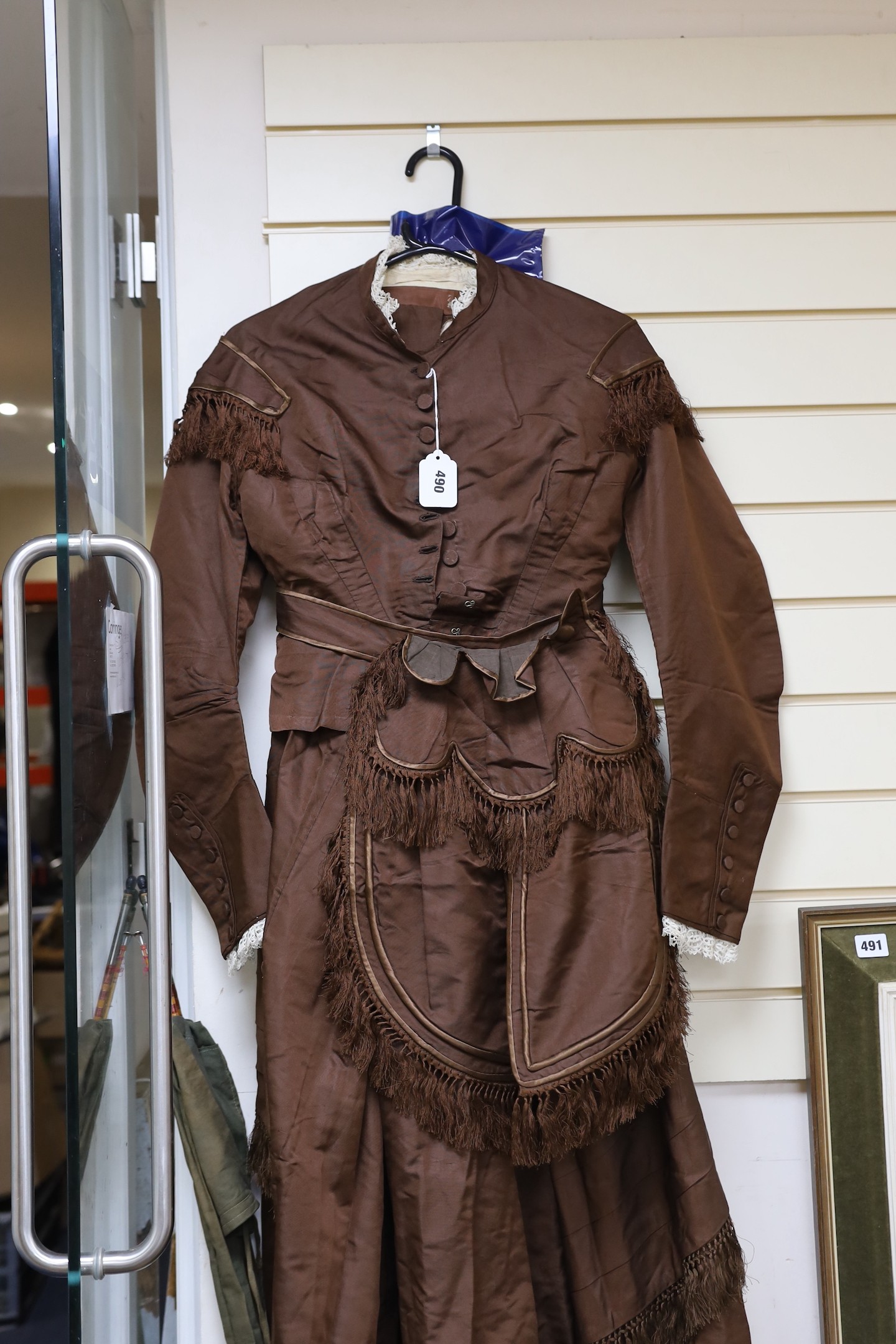 A Victorian brown silk ladies suit skirt and jacket and fronter to the skirt